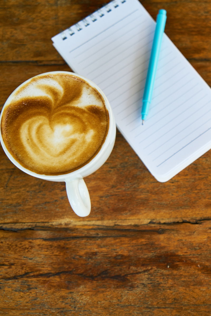 Coffee cup and notepad